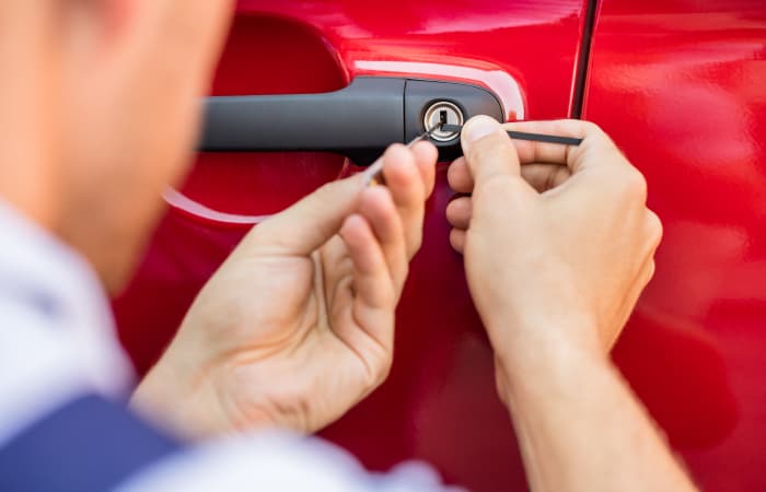 Upclose view of a Pick Brother's Locksmith technician working on an automobile in Fort Myers, Florida.