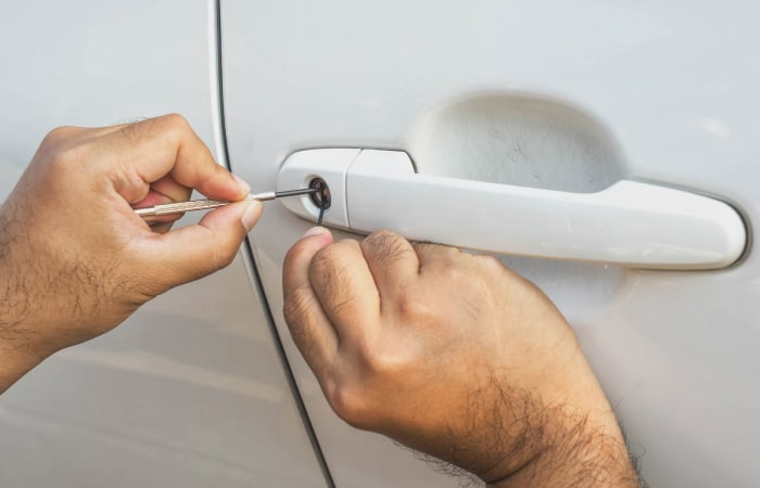 Upclose view of a Pick Brother's Locksmith technician working on an automobile in Fort Myers, Florida.